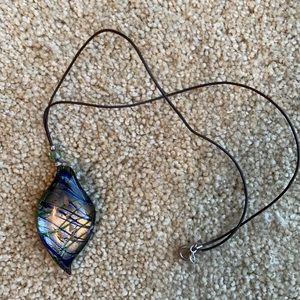 Glass pendant - about 2 in on cord about 10 in